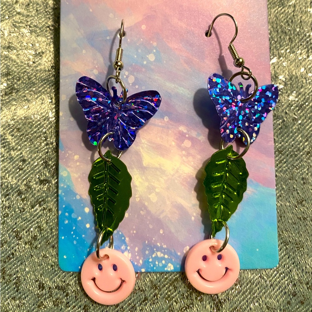 Butterfly earrings smiley face leaves holographic